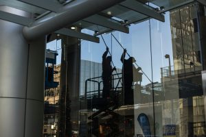 professional commercial cleaning company, cleaning the windows on a building