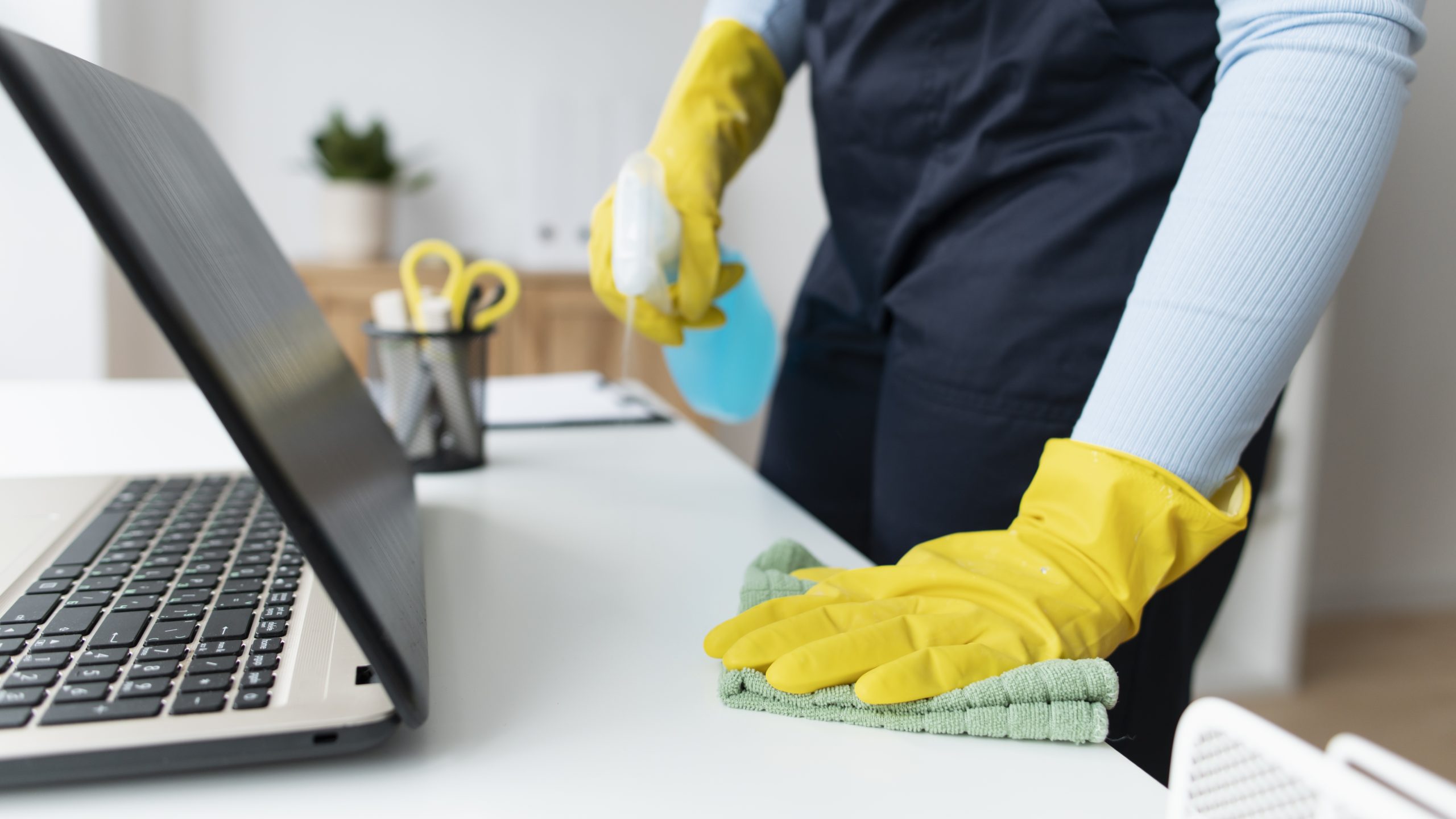 Cleaner sanitizing a desk